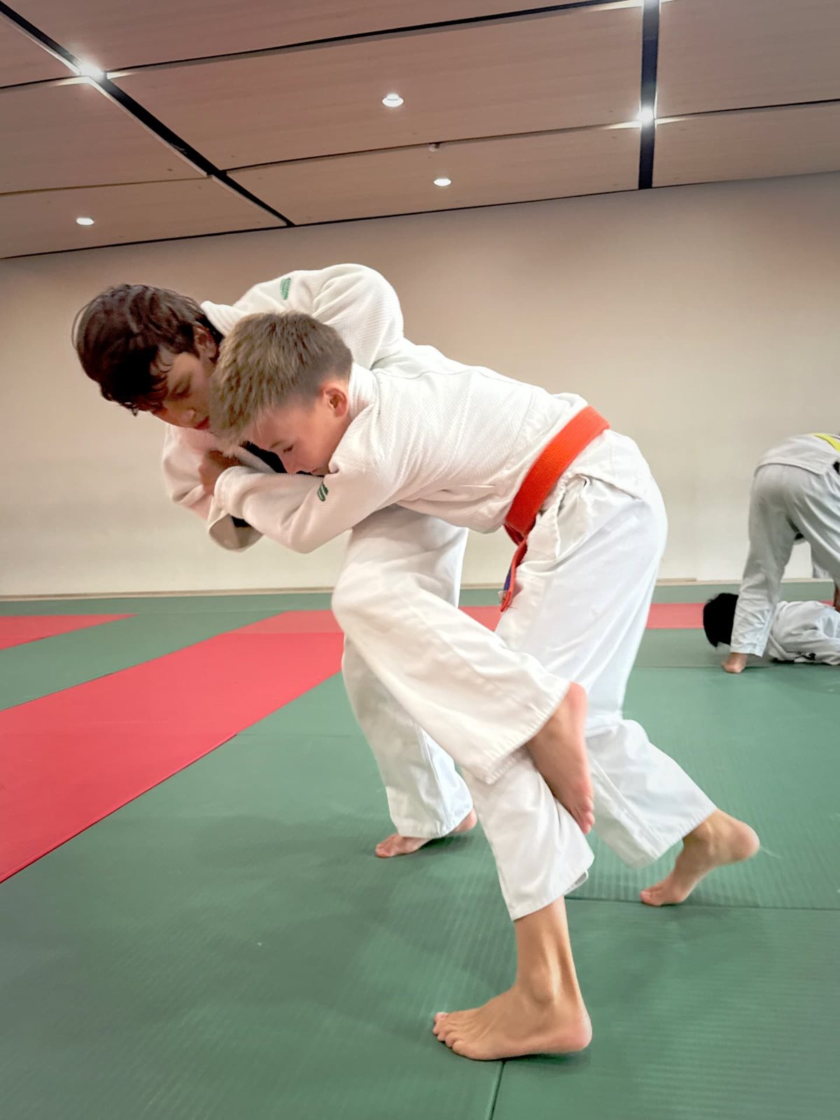 Two young judoka gripping up during randori at San Diego Judo