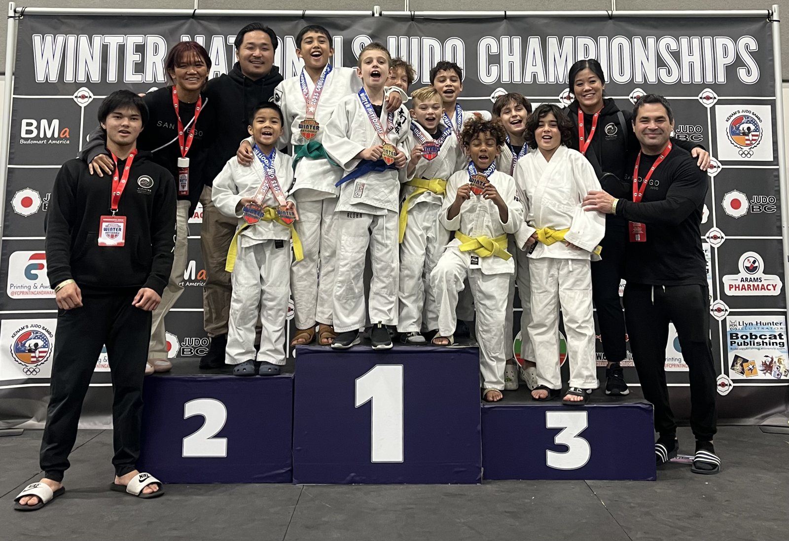 San Diego Judo team and coaches on the podium at the Winter Nationals Judo Championships